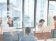 marketing team on computers implementing an AI marketing pilot
