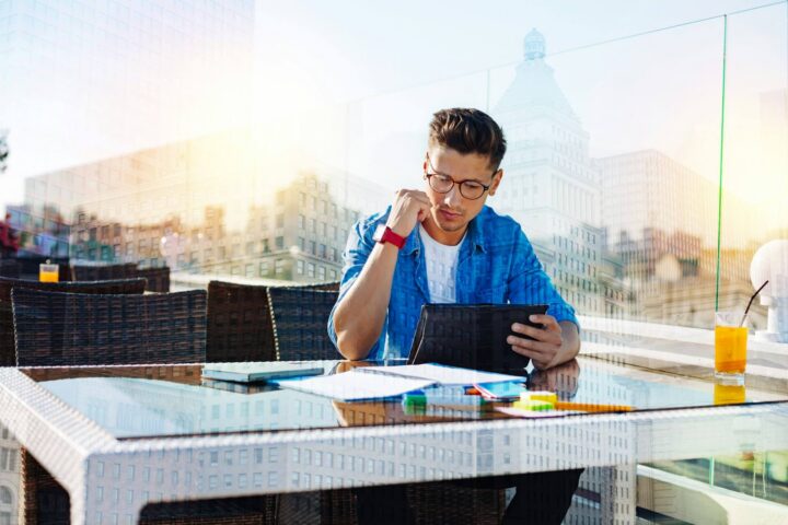 professional using a tablet interacting with technology